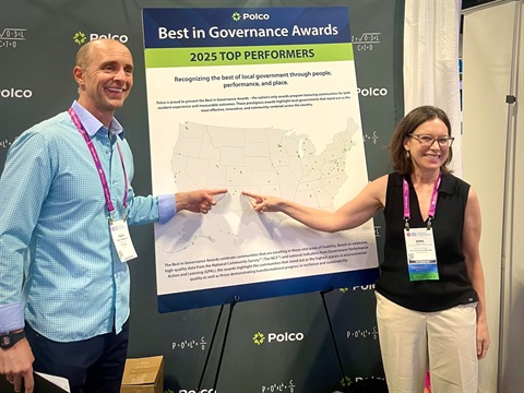 Los Alamos County Manager Anne Laurent standing with Tobin McKearin, COO of POLCO in celebration of Los Alamos County placing among the top finalists nationwide in Polco’s 2025 Best in Governance Awards.
