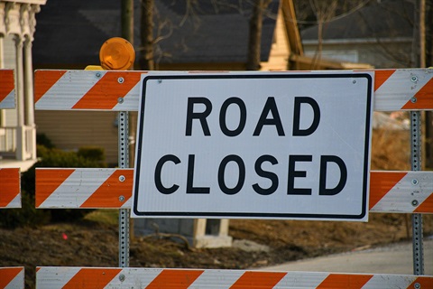 Road Closed Sign image showing a road closure barricade