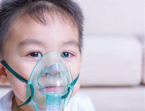 Baby with an oxygen mask