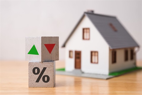 picture of house with blocks in front of it. One has an up arrow, one has a down arrow, and one has a percentage sign.