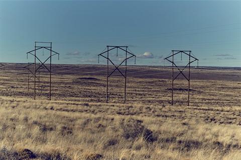 Powerlines crossing vast, open space somewhere in New Mexico