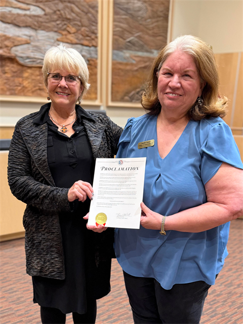 Los Alamos County Councilor Melenee Hand presents a proclamation designating Nov. 29 as Small Business Saturday in Los Alamos to Los Alamos Chamber of Commerce Director Sandy Jones during the November 4 County Council meeting.