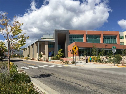 Photograph of the east side of the Los Alamos County Municipal Building on a spring day. 
